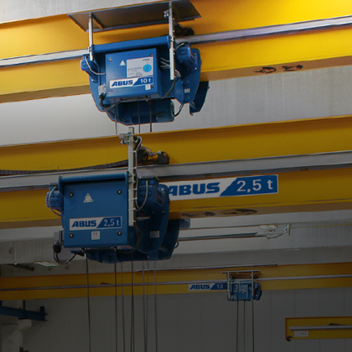 Carrello monorotaia ABUS serie E per la movimentazione compatta dei materiali e una tecnologia gru efficiente in ambito industriale.