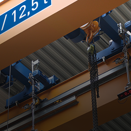 Carrello birotaia ABUS, modello D, su un impianto gru con paranco a catena e portata fino a 63 t.